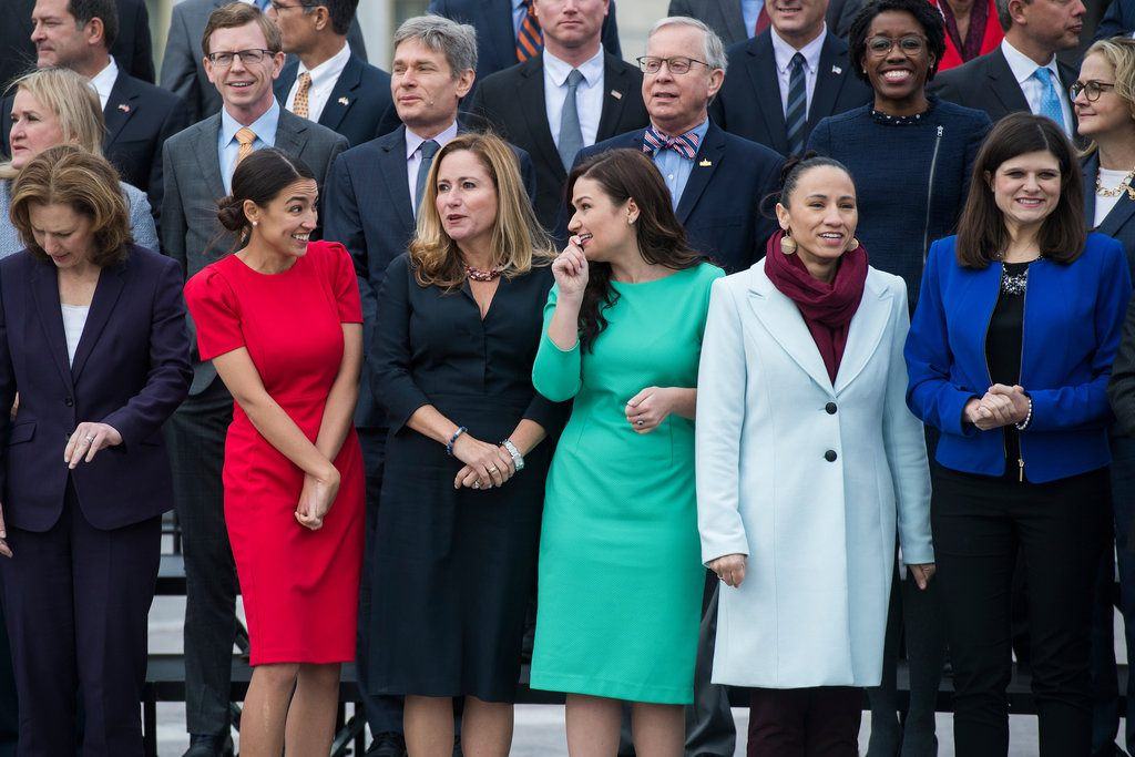 Members-elect, front row from left, Kim Schrier, D-Wash., Alexandria Ocasio-Cortez, D-N.Y., Debbie Mucarsel-Powell, D-Fla., Abby Finkenauer, D-Iowa, Sharice Davids, D-Kan., Haley Stevens, D-Mich., and other members of the incoming freshman class, pose for a photo on the East Front of the Capitol on Nov. 14. (Tom Williams/CQ Roll Call)